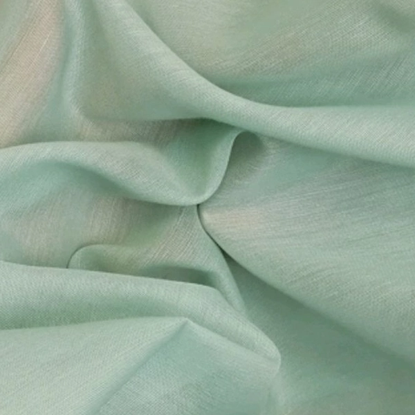 A close-up image shows a translucent, pale mint green fabric draped in soft folds, revealing its sheer quality and subtle texture.