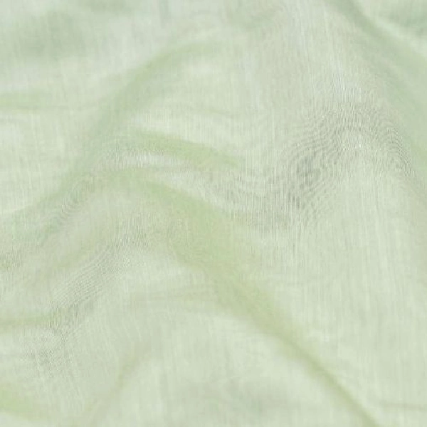 A close-up of wrinkled sheer light green fabric.