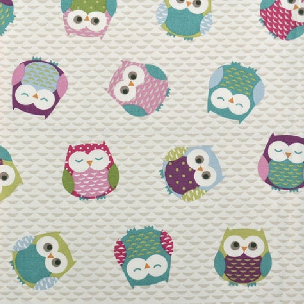 Kids curtain fabric with a pattern of colorful stylized owls on a light gray background.