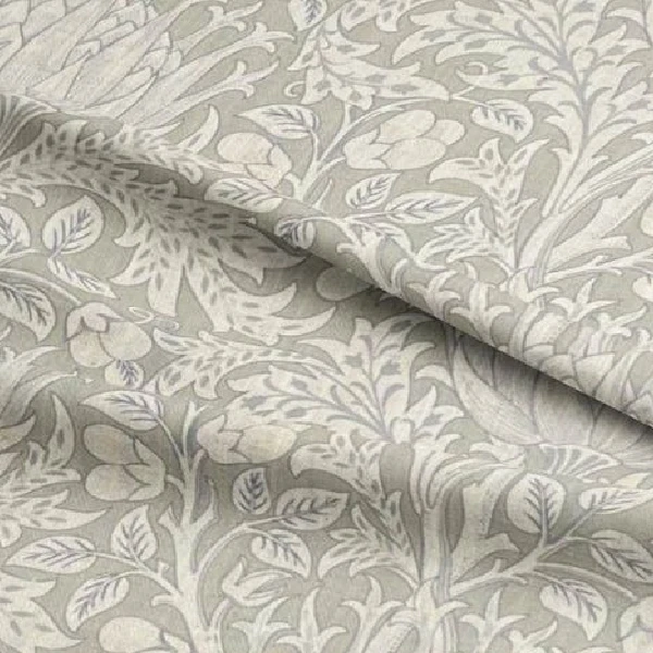 Light grey floral patterned curtain fabric.