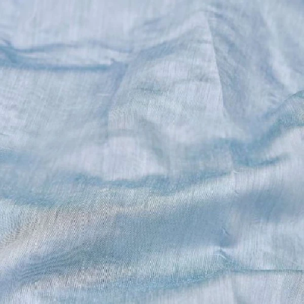 Sheer light blue curtain fabric.