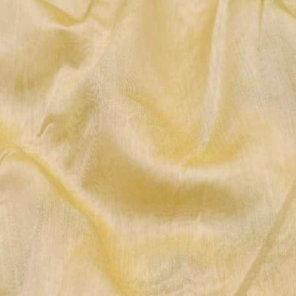 Sheer light yellow curtain fabric.