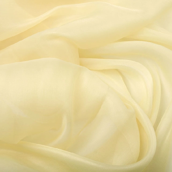 Sheer, soft pale yellow fabric with visible creases and graceful drapes, demonstrating its translucent nature