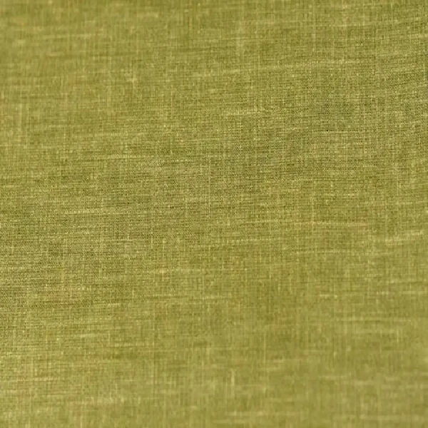 A close-up of green curtain fabric with a subtle, textured weave.