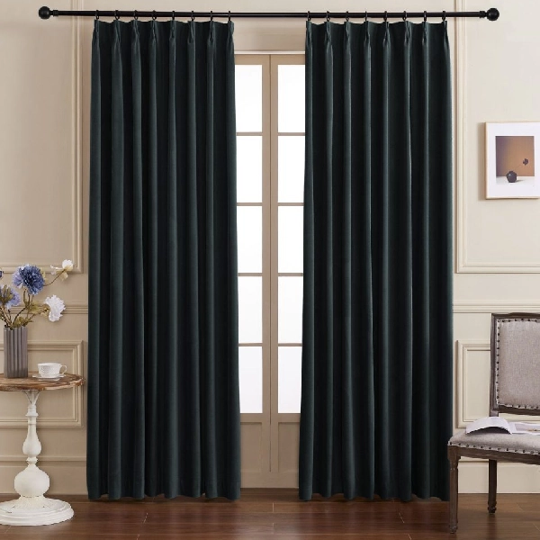Pinch pleat curtains in a black color.