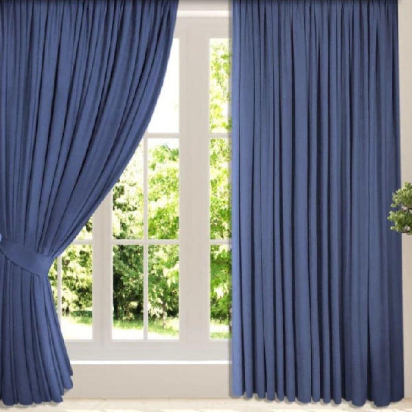 blue curtain tied back to the left.
